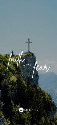 "faith over fear" cross on a mountain cliff
