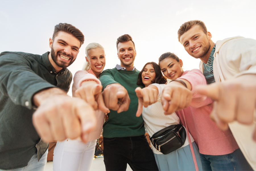 People in a group pointing